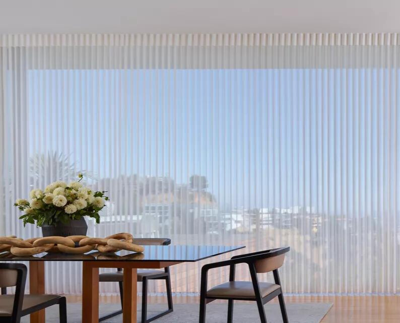 A large window with sheer blinds