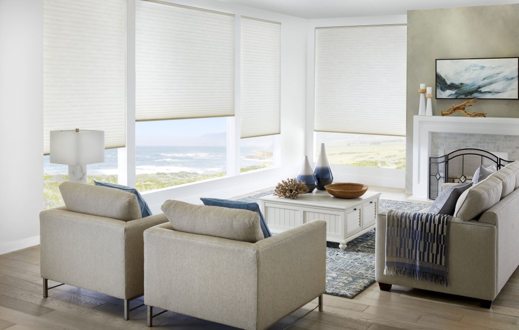 Living room furniture facing a window with blinds