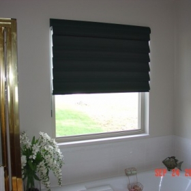 Black roman shades in a bathroom