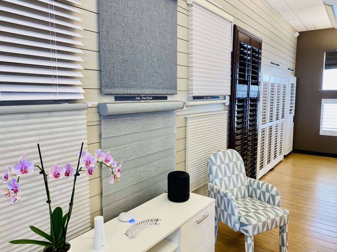 A display of blinds and shutters on a wall